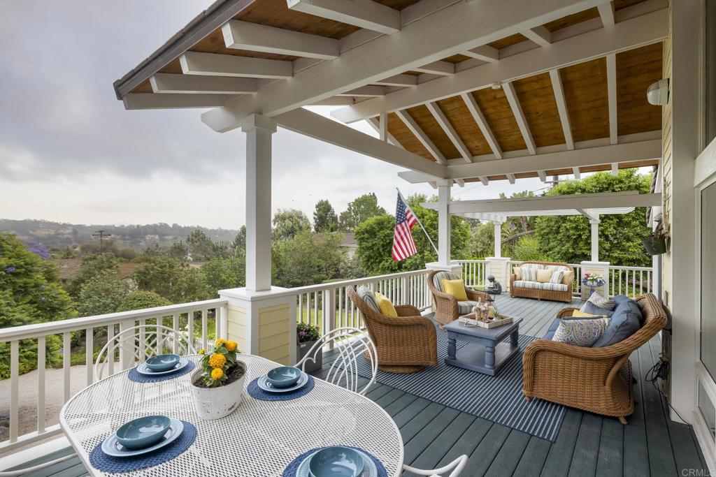 594 Rancho Santa Fe Road Encinitas, CA 92024 - Photo 2 of 47 a view of a balcony with chairs and wooden floor