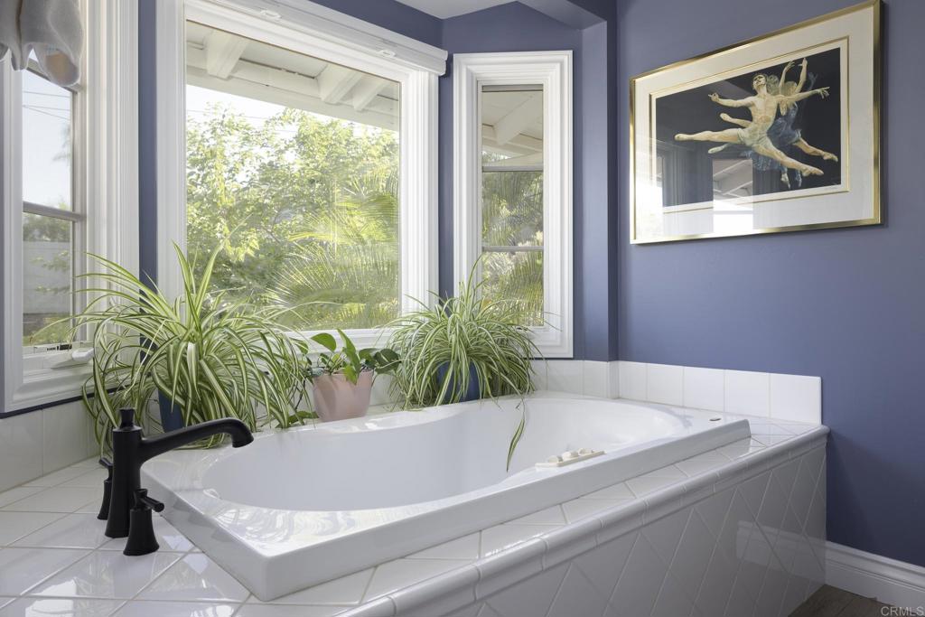 594 Rancho Santa Fe Road Encinitas, CA 92024 - Photo 25 of 47 a white bath tub sitting in a bathroom next to a window