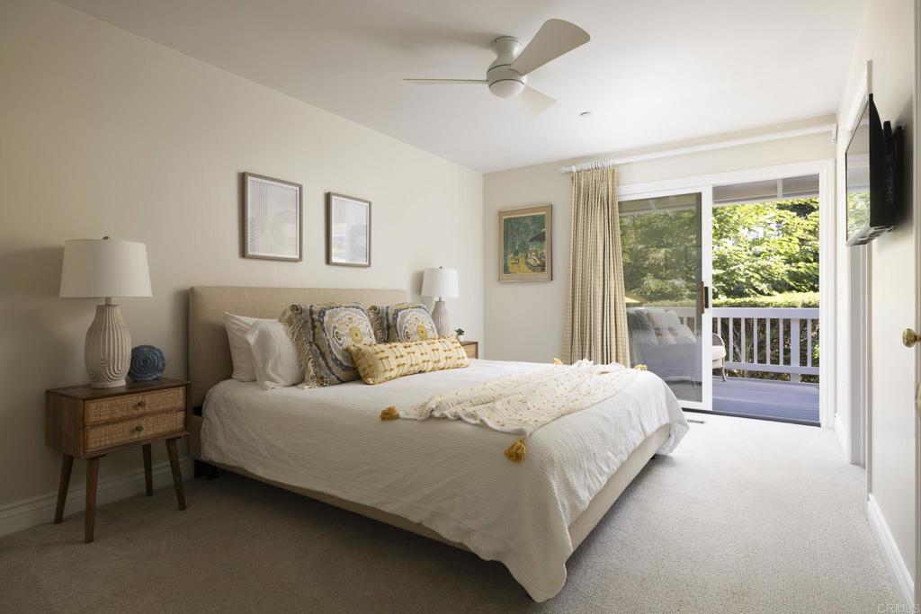 594 Rancho Santa Fe Road Encinitas, CA 92024 - Photo 26 of 47 a bedroom with a bed and a window