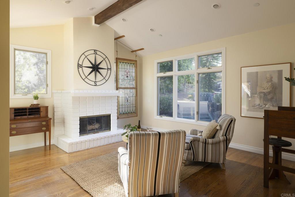 594 Rancho Santa Fe Road Encinitas, CA 92024 - Photo 32 of 47 a living room with furniture a fireplace and a table