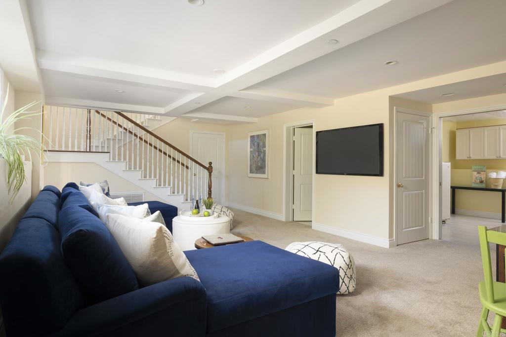 594 Rancho Santa Fe Road Encinitas, CA 92024 - Photo 42 of 47 a living room with furniture and a flat screen tv
