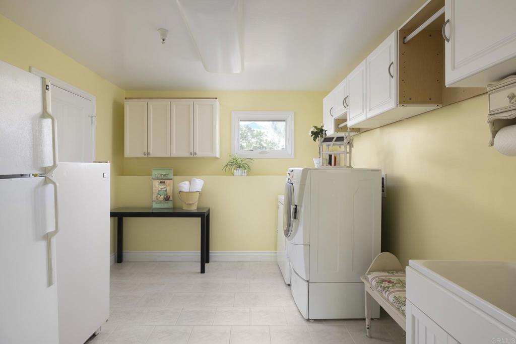 594 Rancho Santa Fe Road Encinitas, CA 92024 - Photo 44 of 47 a white refrigerator freezer sitting in a kitchen