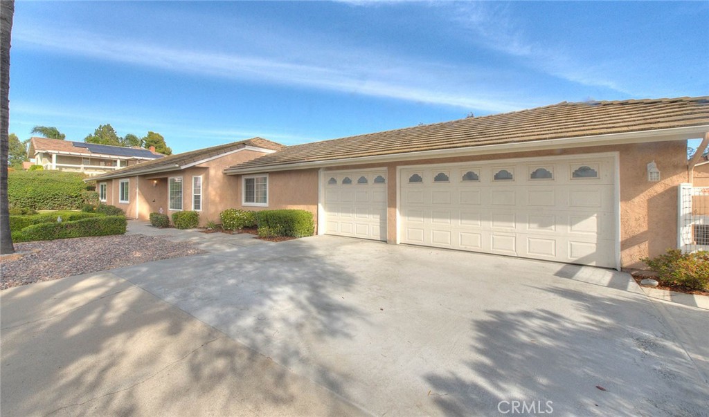 30673 Del Rey Road Temecula, CA 92591 - Photo 4 of 47 Three Car Garage. Exterior Has Been Completely Repainted Along With All Wood Trim And Fascia Repaired And Repainted Plus Windows Upgraded To Vinyl Windows! No Exterior Maintenance For Years To Come!