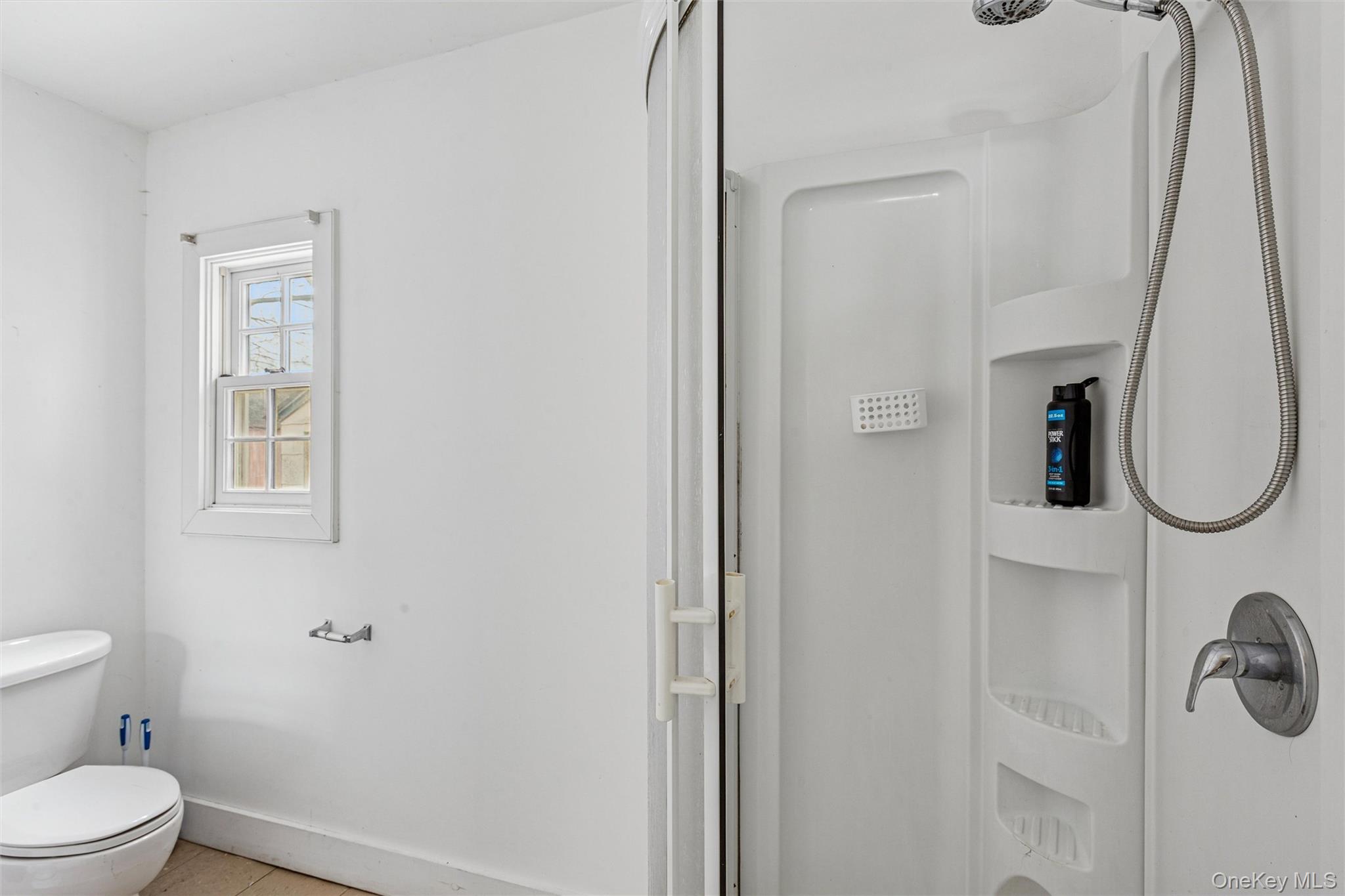 250 Main Road Riverhead, NY 11901 - Photo 12 of 31 a bathroom with a toilet and a shower