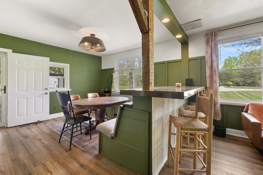 5120 Wheelock Road Troy, OH 45373 - Photo 13 of 67 This inviting dining area features warm wood flooring and a charming built-in seating.