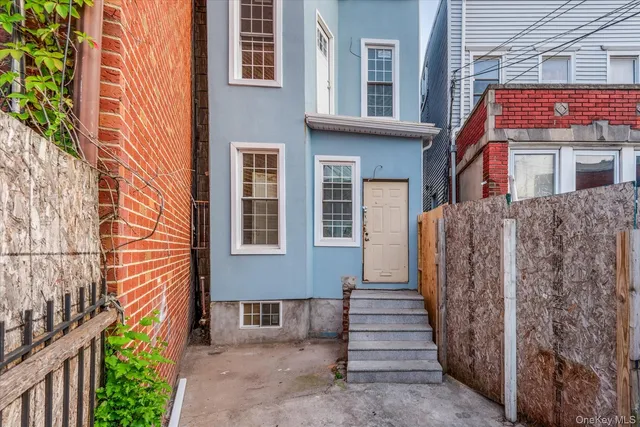 a view of a brick building with many windows
