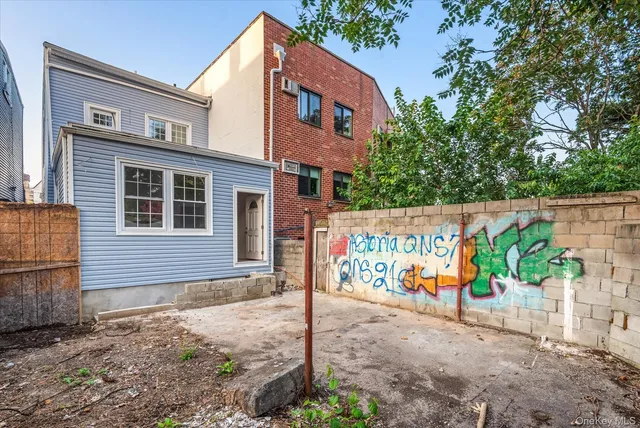 a view of a patio with table and chairs and potted plants