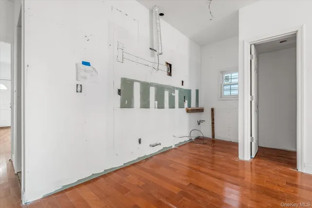 a view of a livingroom with wooden floor