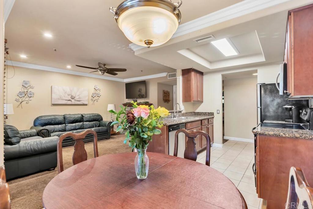 1434 Marshall Road, Unit 37 Alpine, CA 91901 - Photo 1 of 1 a dining room with furniture and a chandelier