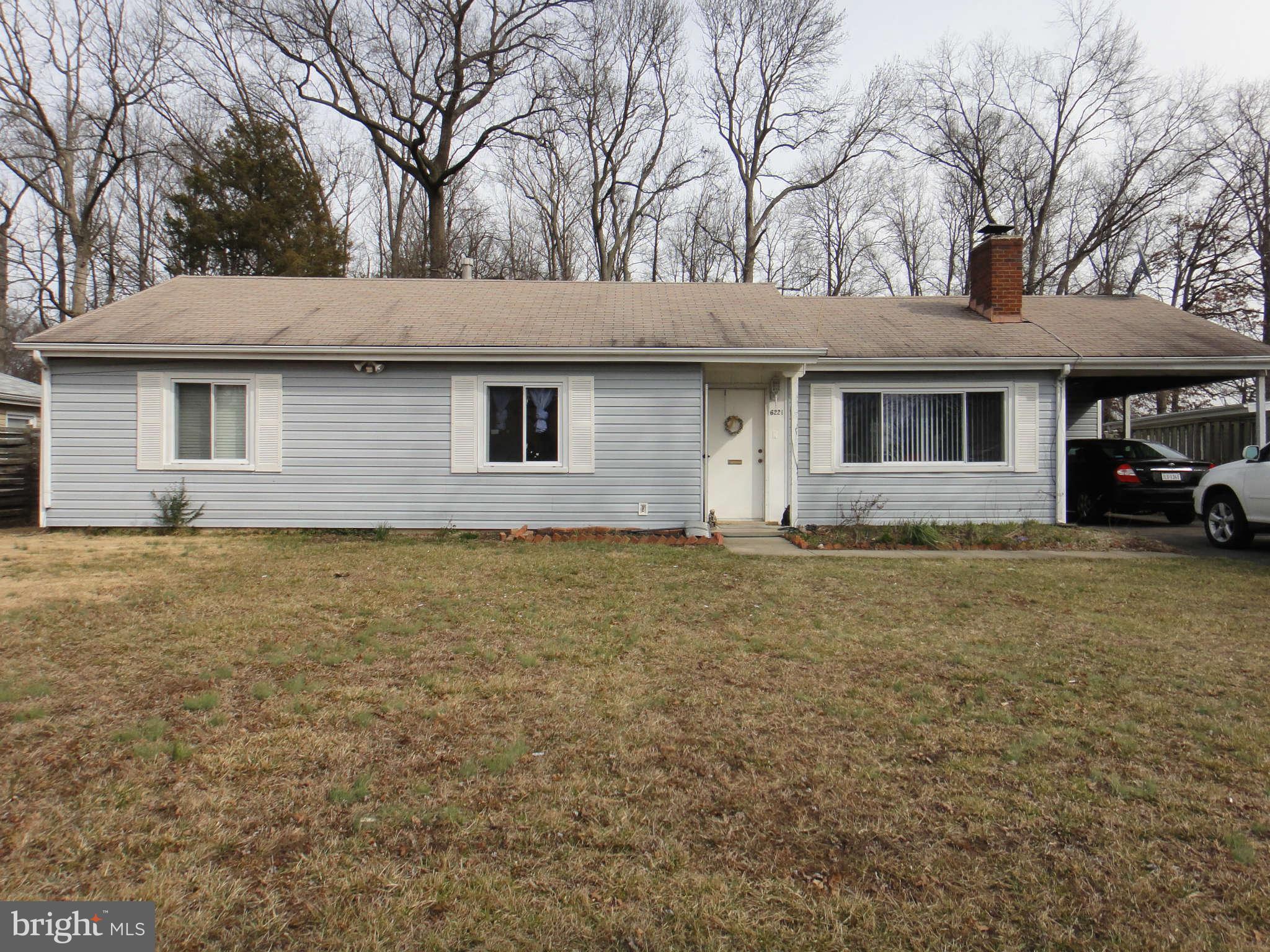 6221 Frontier Drive Springfield, VA 22150 - Photo 2 of 18 a house that has a tree in front of it