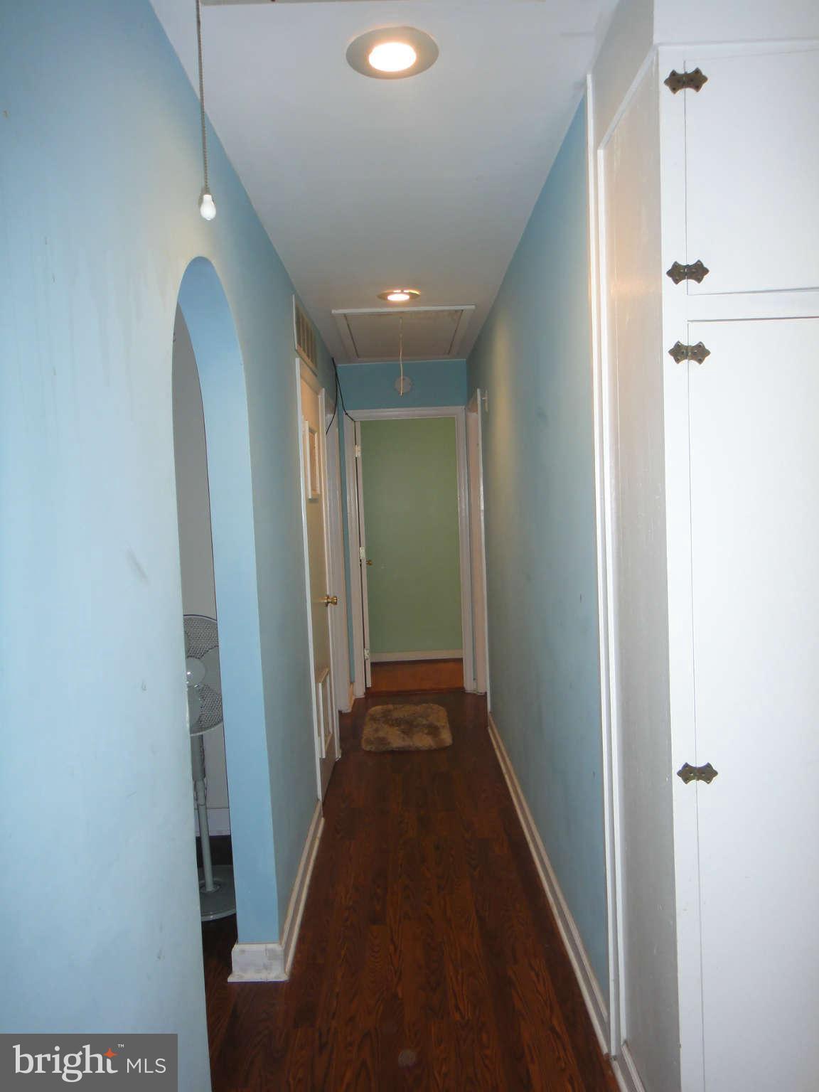 6221 Frontier Drive Springfield, VA 22150 - Photo 15 of 18 a view of a hallway with wooden floor
