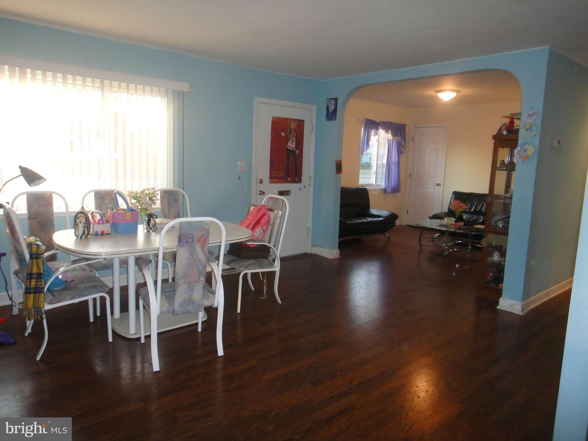 6221 Frontier Drive Springfield, VA 22150 - Photo 3 of 18 a view of a dining room with furniture and wooden floor