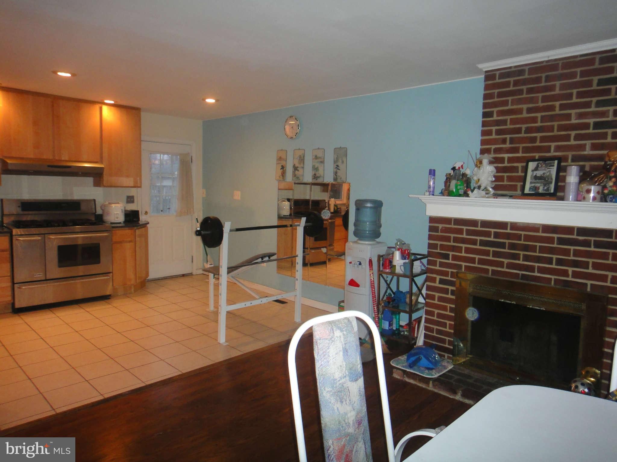 6221 Frontier Drive Springfield, VA 22150 - Photo 8 of 18 a kitchen with stainless steel appliances granite countertop a stove a sink and a refrigerator