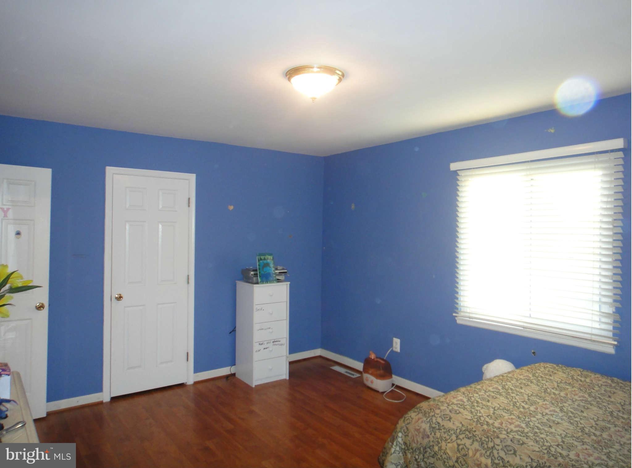 6221 Frontier Drive Springfield, VA 22150 - Photo 10 of 18 a bedroom with bed and window