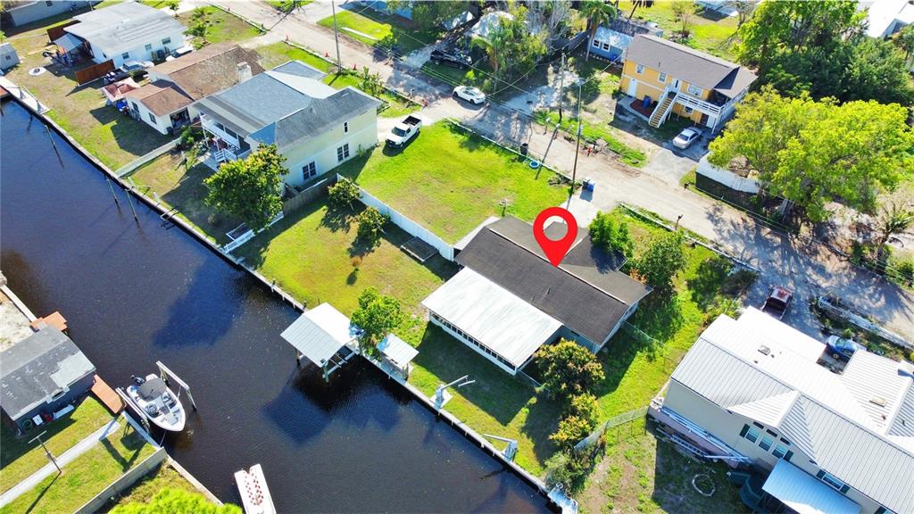 an aerial view of a house with a swimming pool
