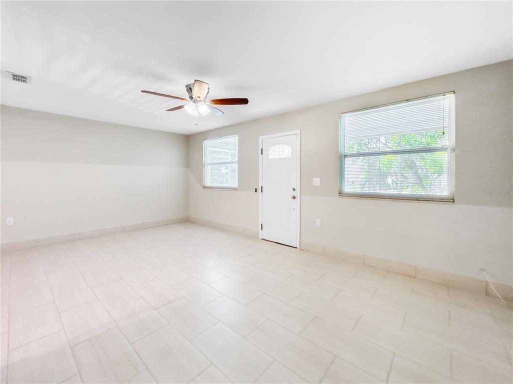 133 18th Street Northwest Ruskin, FL 33570 - Photo 13 of 25 an empty room with a window and a ceiling fan