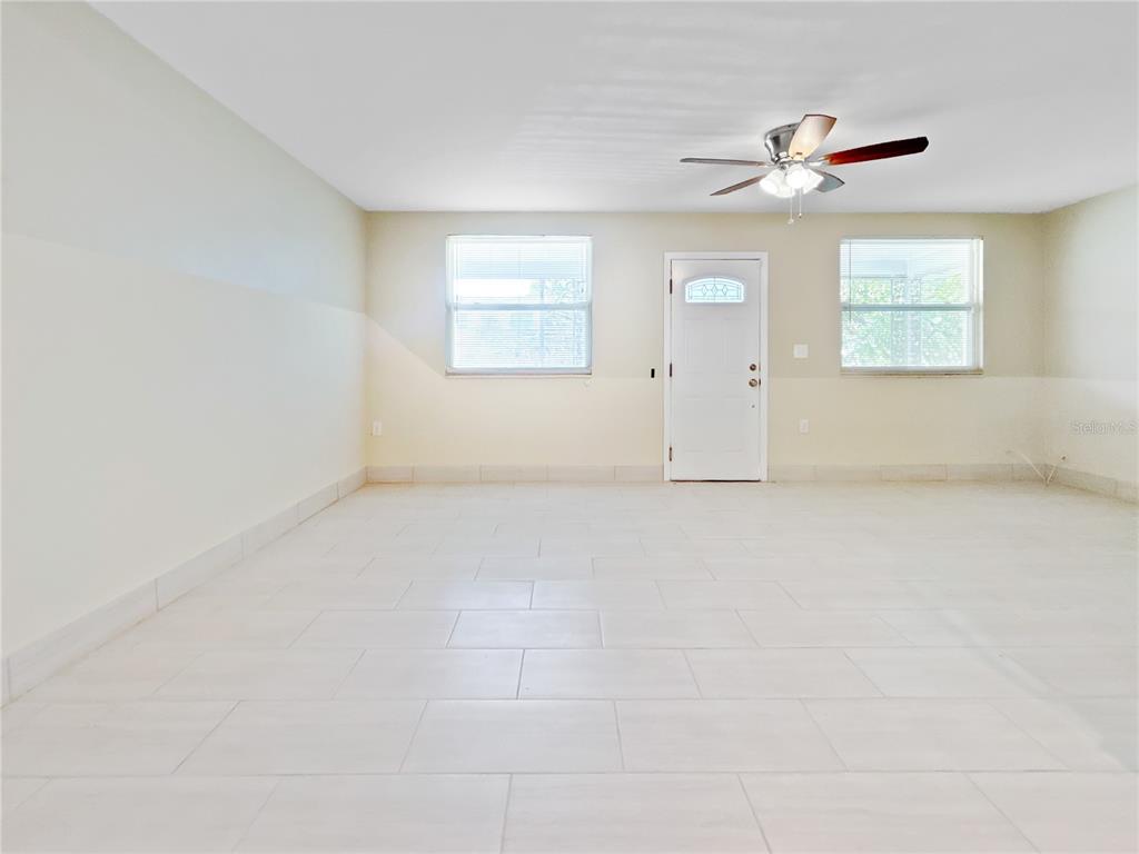 133 18th Street Northwest Ruskin, FL 33570 - Photo 16 of 25 an empty room with windows and fan