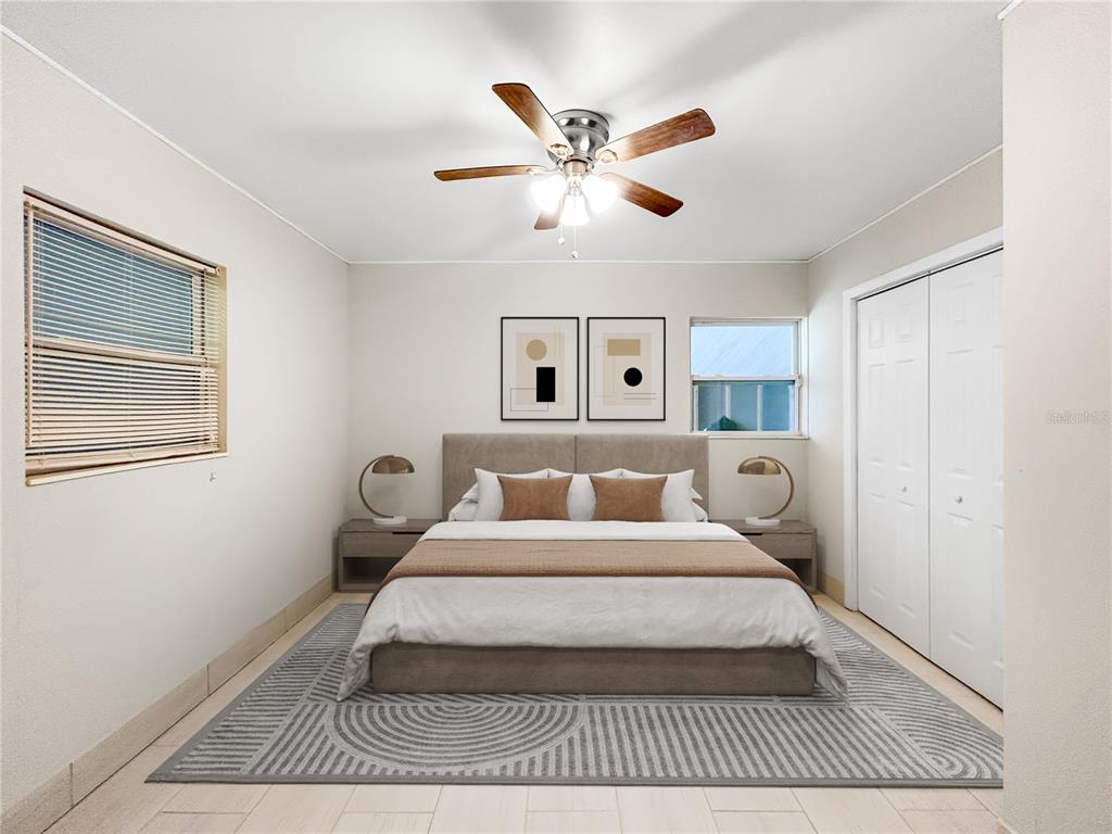 133 18th Street Northwest Ruskin, FL 33570 - Photo 17 of 25 a bedroom with a large bed and a window