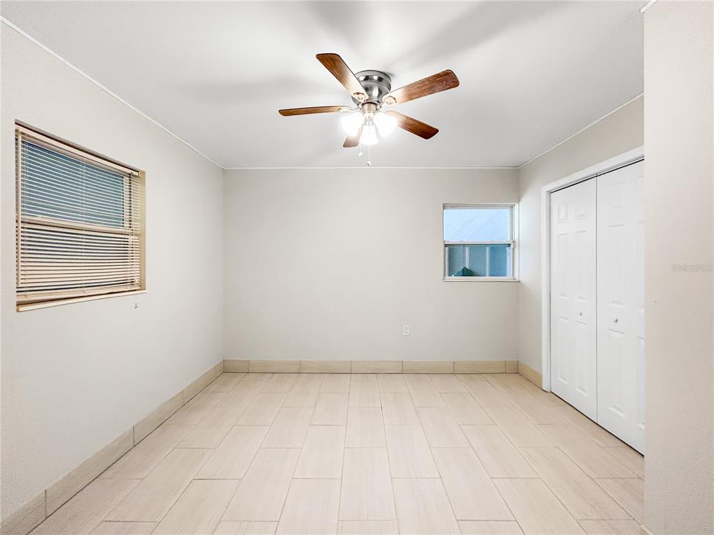 133 18th Street Northwest Ruskin, FL 33570 - Photo 18 of 25 wooden floor in an empty room with a window