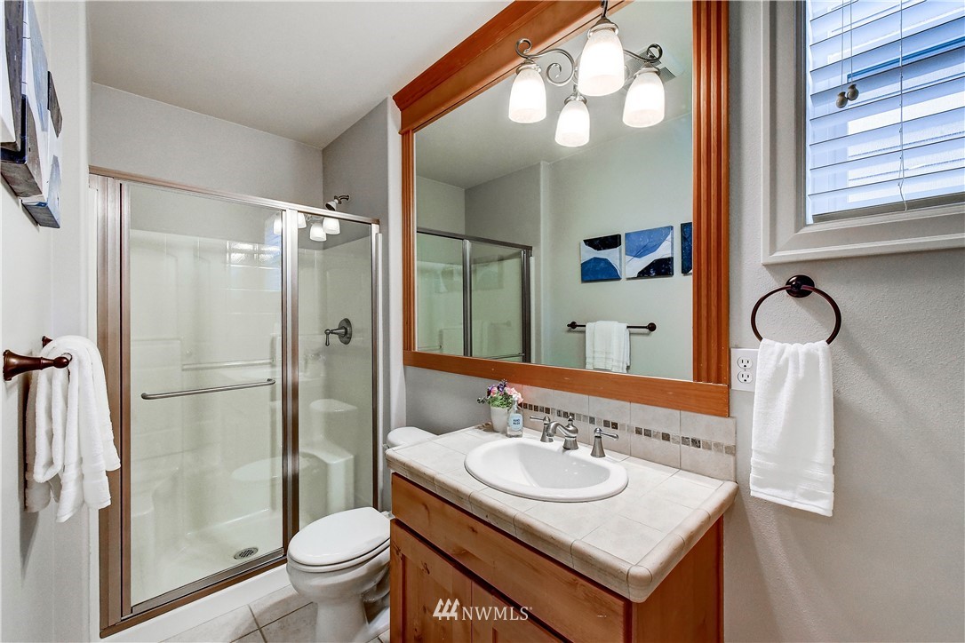 20903 Pioneer Way Edmonds, WA 98026 - Photo 11 of 21 a bathroom with a sink and a mirror