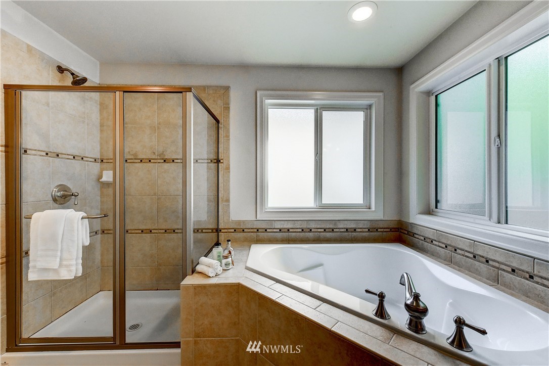 20903 Pioneer Way Edmonds, WA 98026 - Photo 15 of 21 a bathroom with a bathtub and a shower