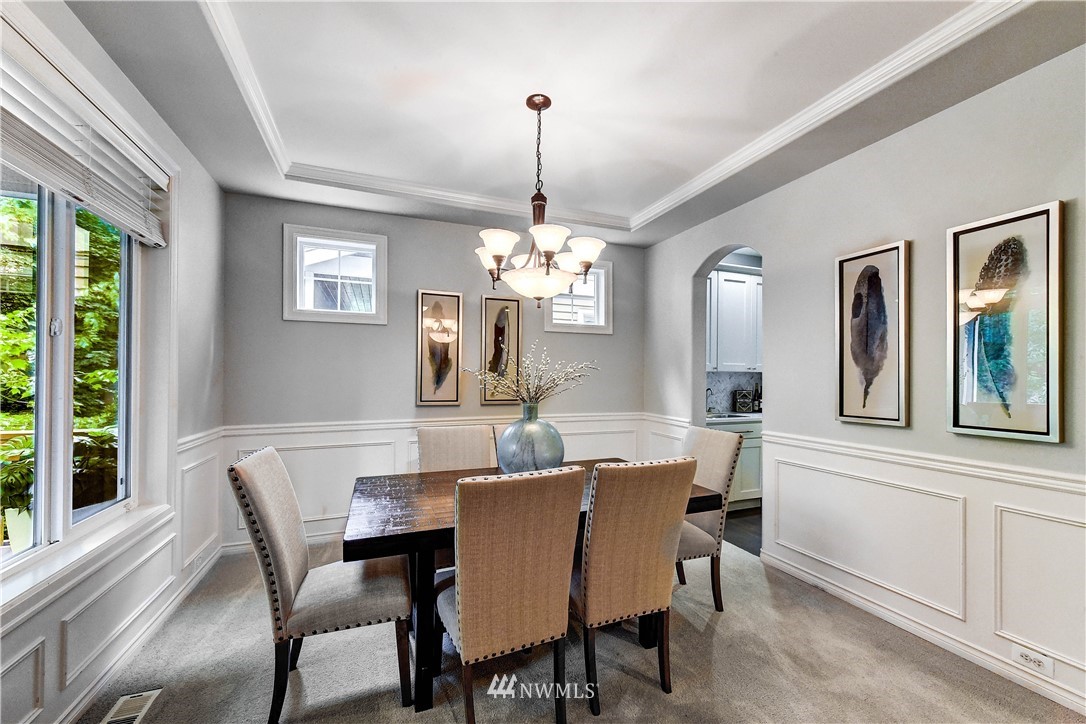 20903 Pioneer Way Edmonds, WA 98026 - Photo 3 of 21 a dining room with furniture a chandelier and window