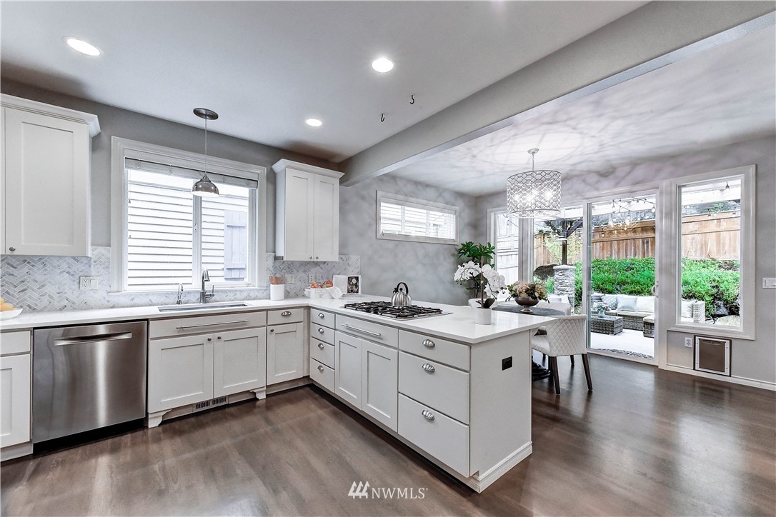 20903 Pioneer Way Edmonds, WA 98026 - Photo 6 of 21 a kitchen with sink and wooden floor