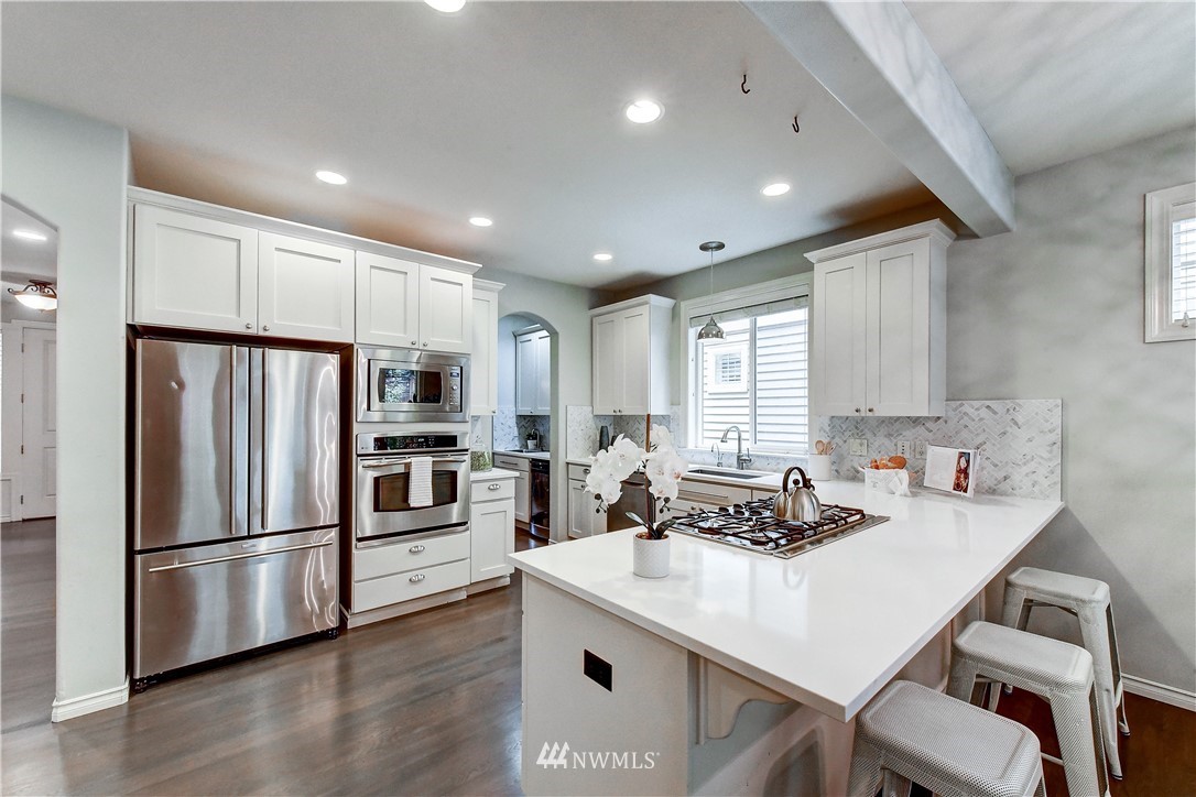 20903 Pioneer Way Edmonds, WA 98026 - Photo 7 of 21 a kitchen with a refrigerator a stove a sink and a refrigerator