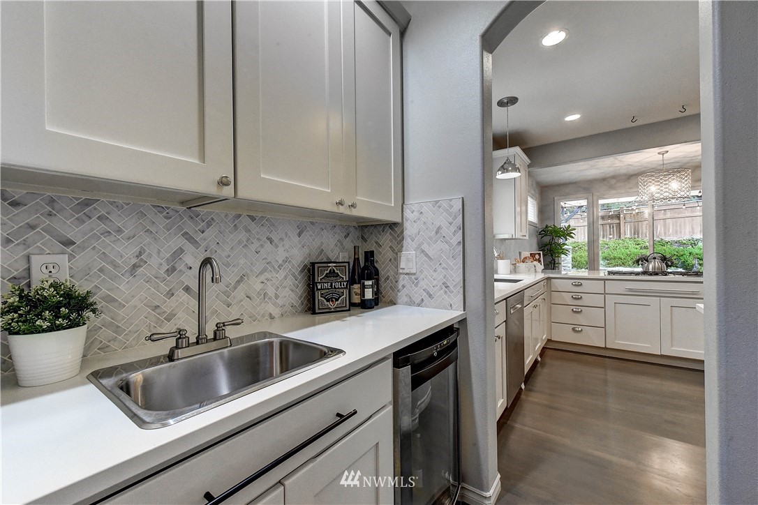 20903 Pioneer Way Edmonds, WA 98026 - Photo 8 of 21 a kitchen that has a sink cabinets counter space and appliances