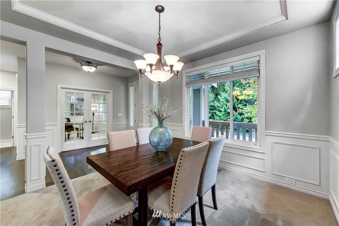 20903 Pioneer Way Edmonds, WA 98026 - Photo 9 of 21 a view of a dining room with furniture window and wooden floor