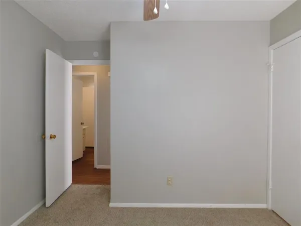 a view of a hallway with closet