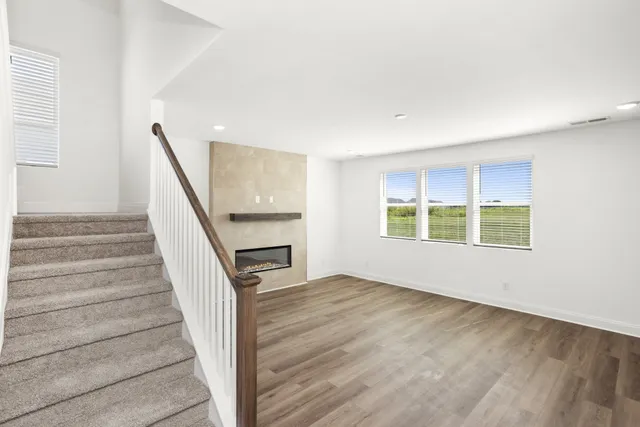 a white toilet sitting next to a white sink
