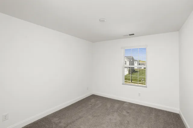 a spacious bathroom with a granite countertop sink mirror and a shower