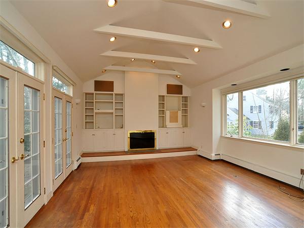 285 Independence Road Concord, MA 01742 - Photo 9 of 26 an empty room with wooden floor and windows