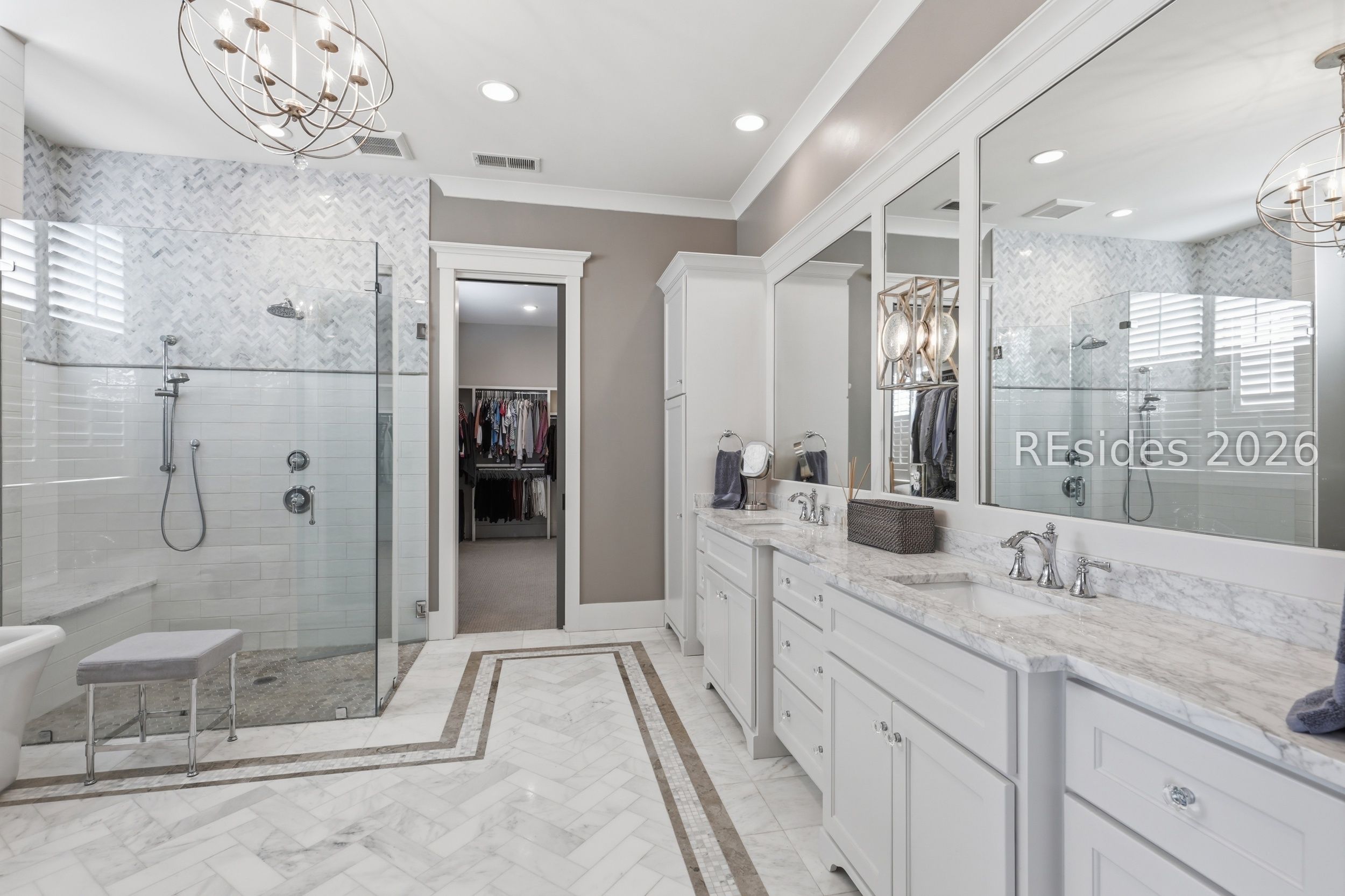20 Fish Dancer Court Bluffton, SC 29910 - Photo 42 of 89 Elegant primary bathroom with marble flooring.