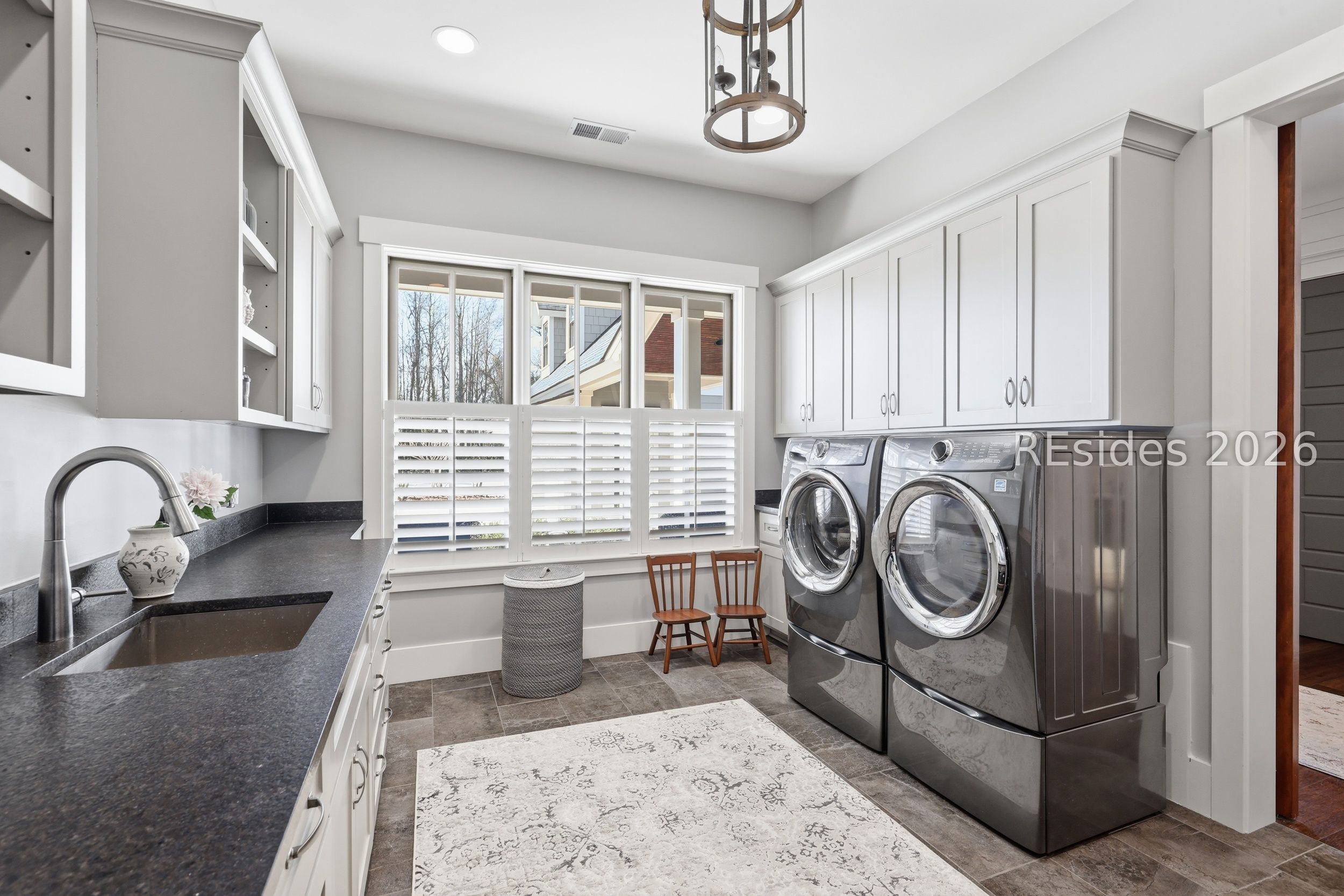 20 Fish Dancer Court Bluffton, SC 29910 - Photo 67 of 89 Large laundry room with lots of cabinets.