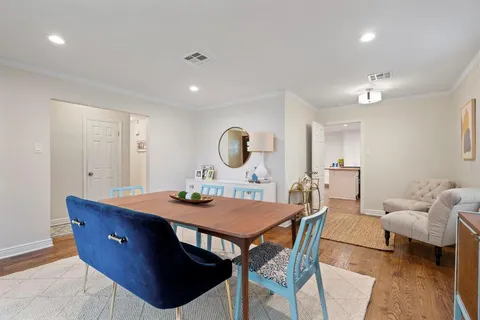 a view of a dining room with furniture and window