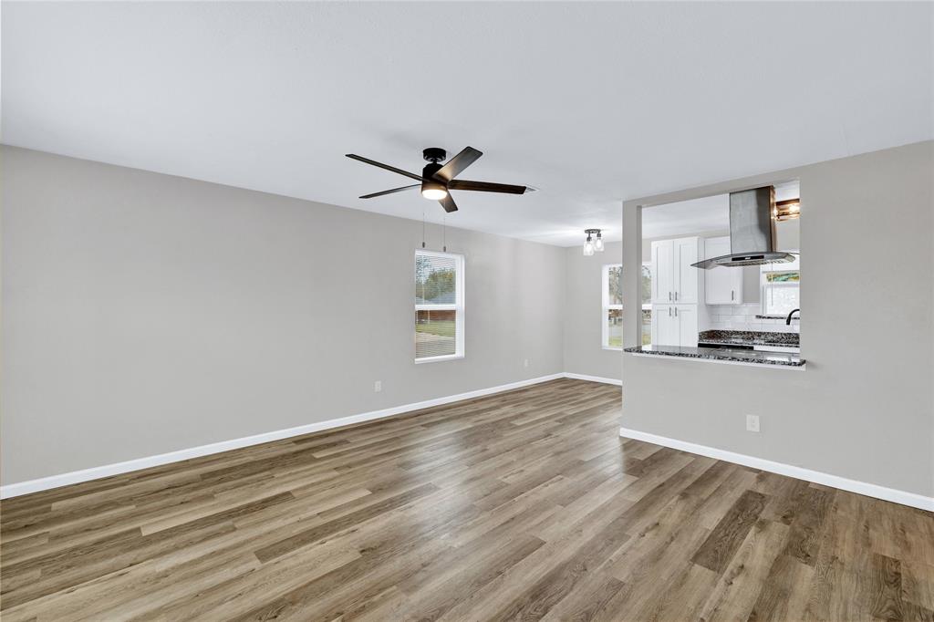 1600 Faulkner Lane Waco, TX 76704 - Photo 5 of 26 a view of empty room with wooden floor and ceiling fan