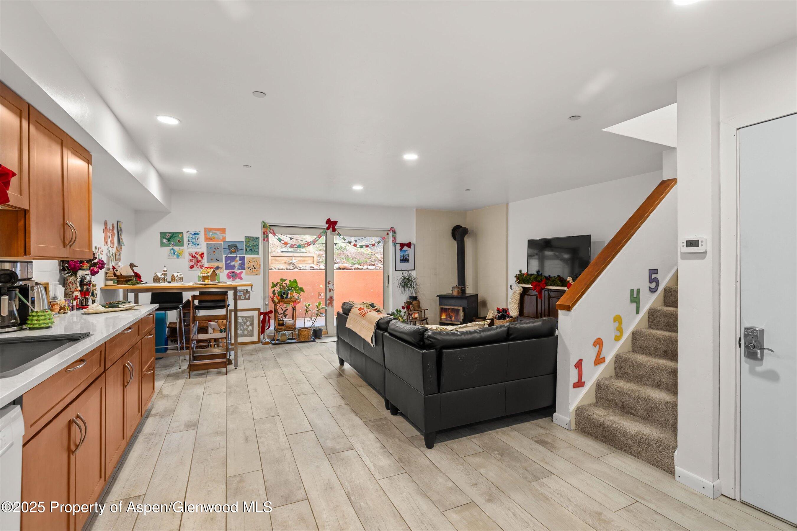 100 Midland Avenue, Unit 108 Basalt, CO 81621 - Photo 4 of 10 a living room with furniture and a wooden floor