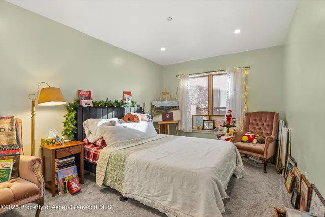 a bed room with a bed and a window