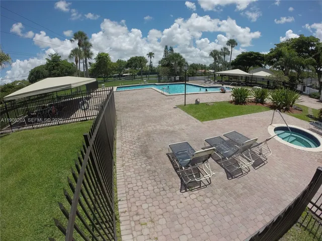 an aerial view of a house with yard