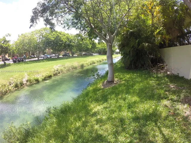 a view of a lake with a big yard