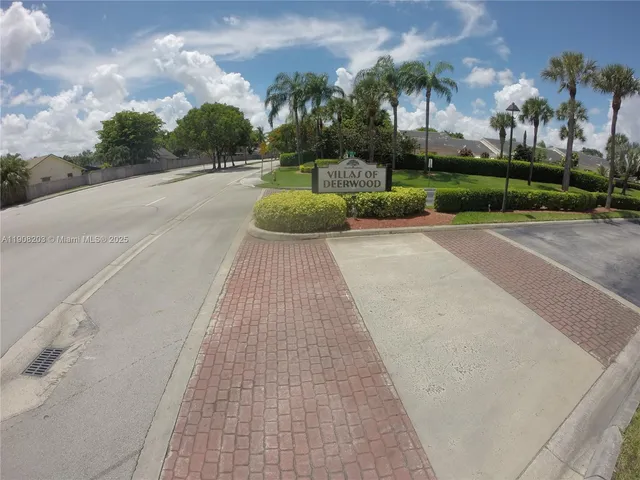 a view of a golf course with a lake