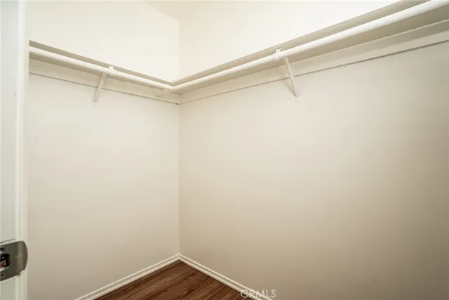 a view of a room with shelf on the wall