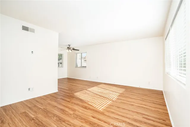 a view of a room with wooden floor