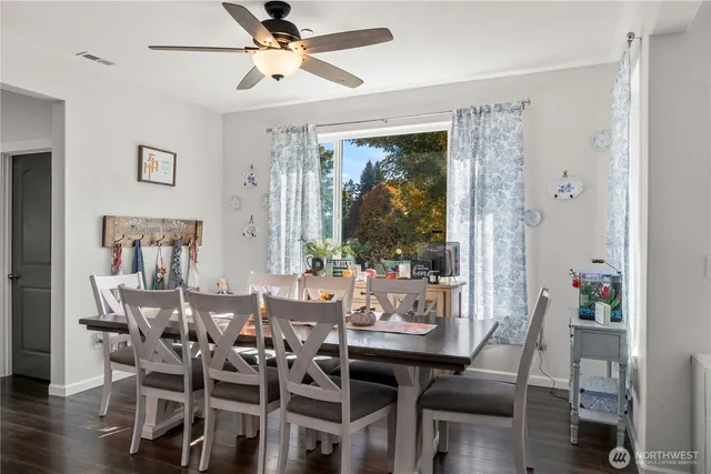 a view of a dining room with furniture window and wooden floor