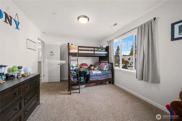 a bed room with furniture and a window