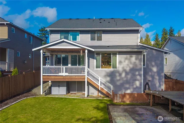 a view of house with a yard