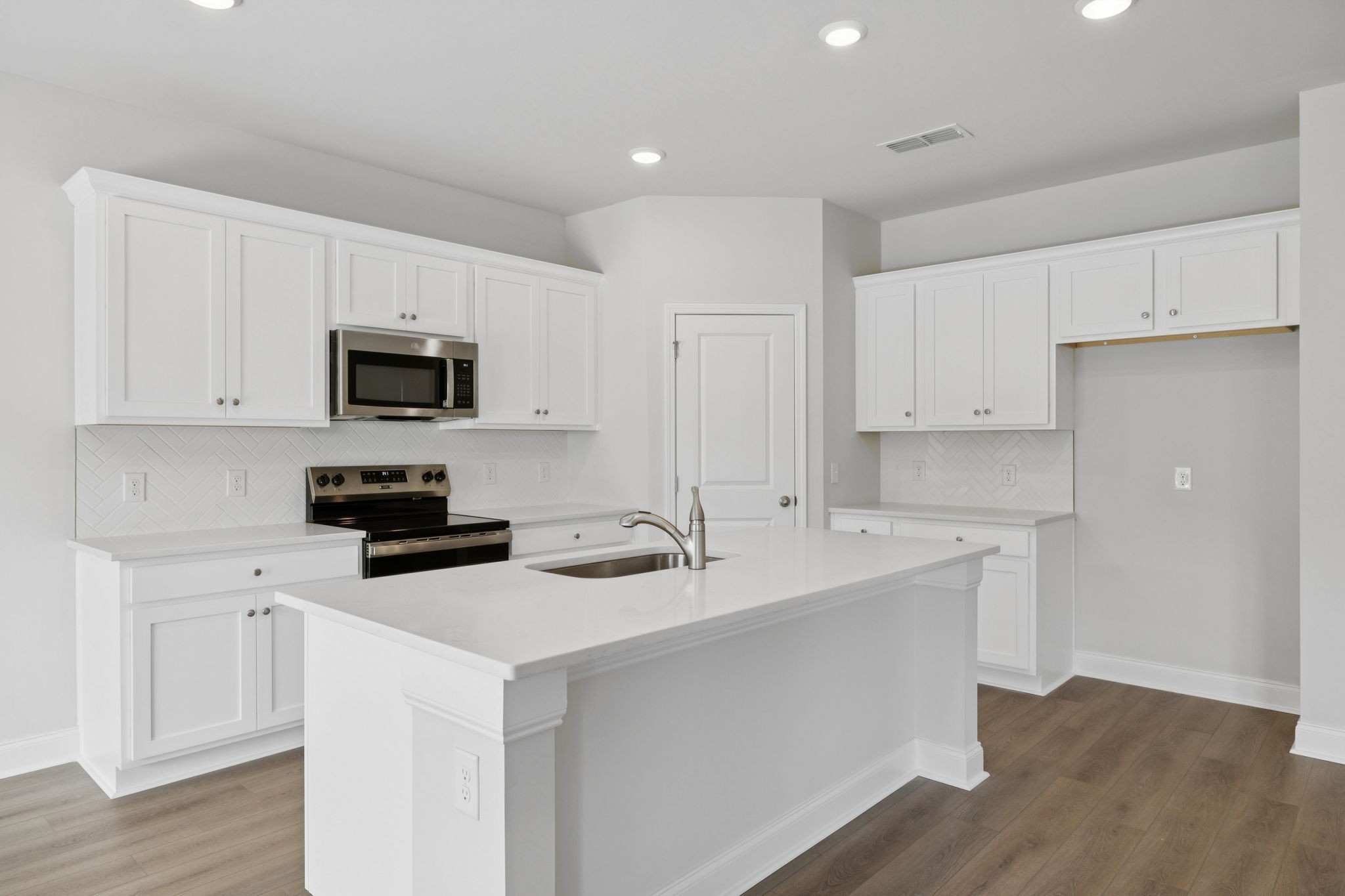 228 Limestone Way Lebanon, TN 37087 - Photo 11 of 45 a kitchen with appliances a sink and cabinets