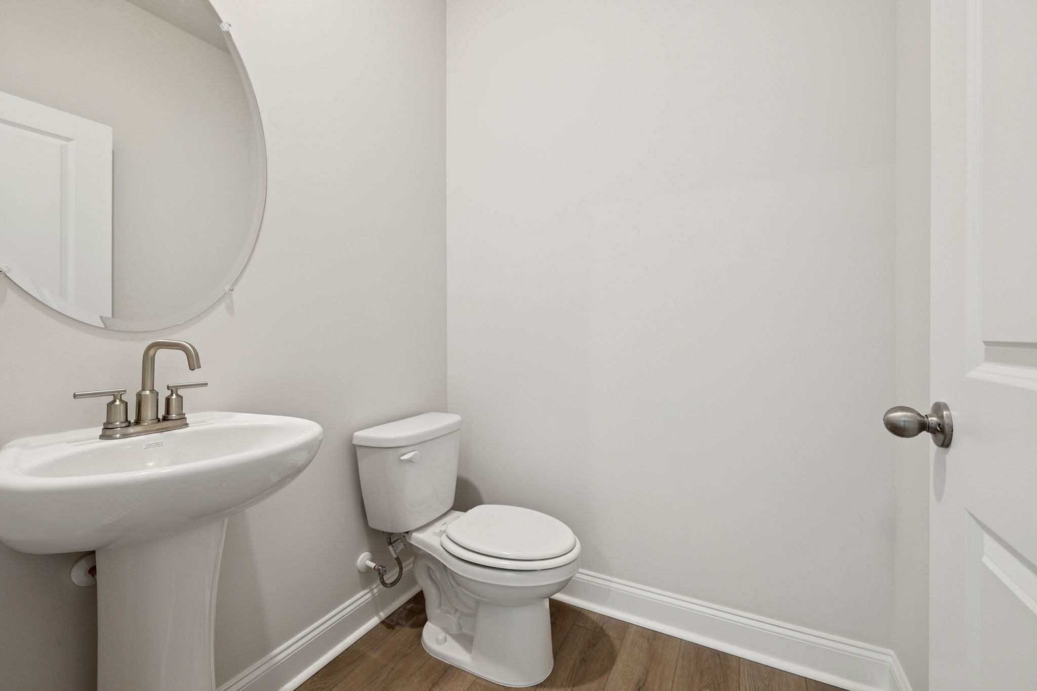 228 Limestone Way Lebanon, TN 37087 - Photo 22 of 45 a bathroom with a toilet a sink and mirror